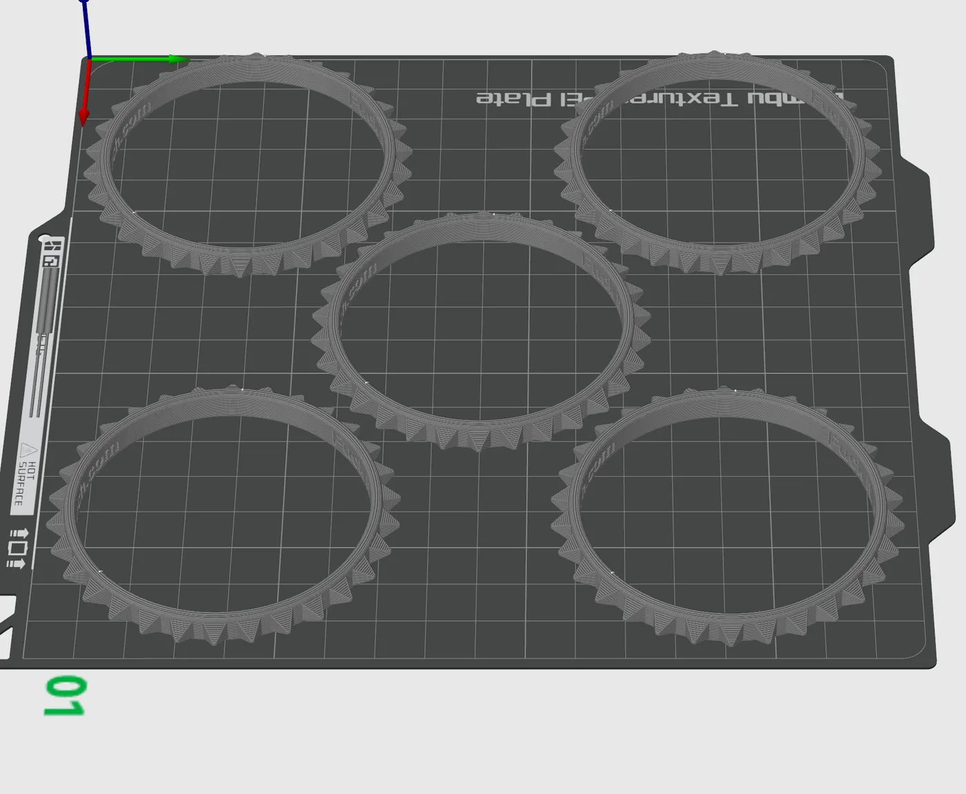 Several bracelet models arranged together on a 3D printer build plate