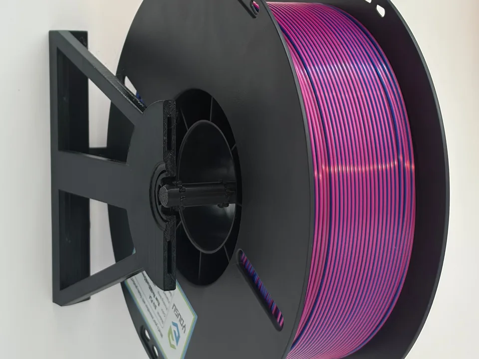 Purple filament spool mounted horizontally in a black 3D printed modular spool holder